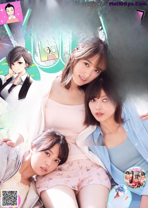 A group of three young women standing next to each other.