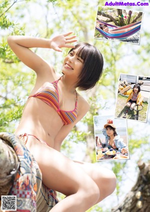 A woman in a bikini top and denim skirt standing next to a grill.