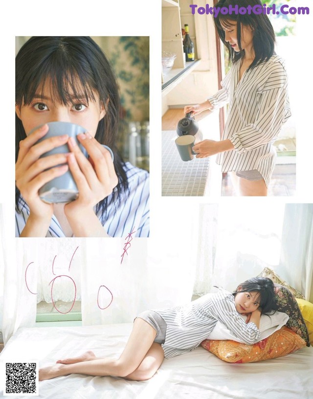 A woman sitting on a bed holding a cup of coffee.